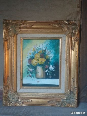Tableau original de vase de fleurs, aux couleurs très joyeuses. Le cadre décoratif est en bois doré,